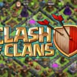 clash of clans logo with blurred base in the background