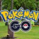 pokemon go logo with graveyard background
